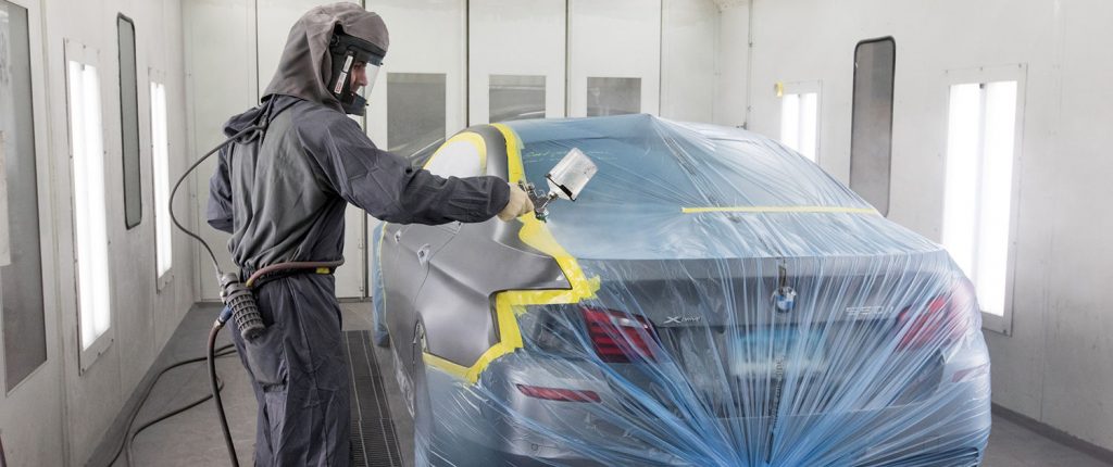 Paint finishing a car by AutoService Man